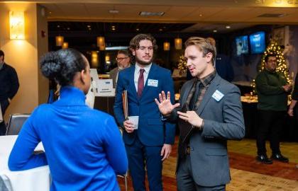 Students talking to an employer at the networking mixer at Northwood